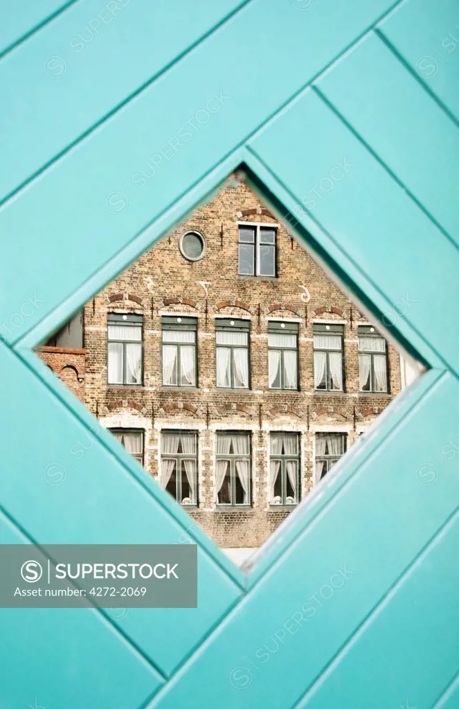 Traditional building reflected in the window, Bruges, Belgium