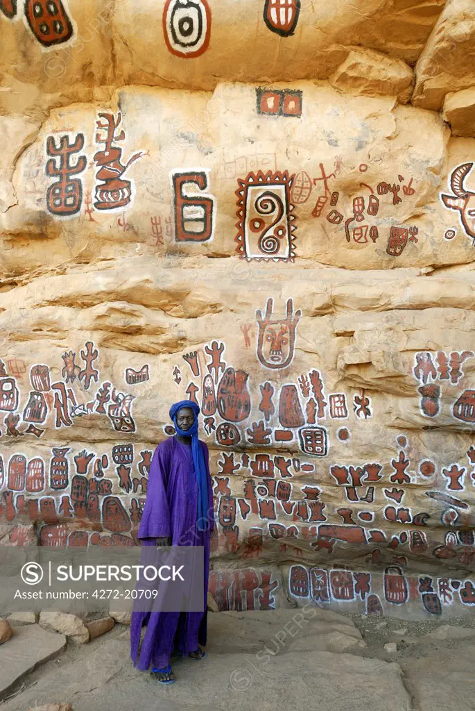A decorated escarpment at the Dogon village of Songho. Magic symbols spread the wall where circumcision of boys takes place each year. Dogon Country, Mali, West Africa
