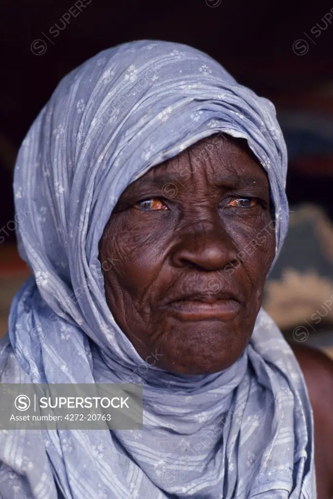 Portrait of an old Mauritanian woman. The life expectancy of Mauritanians is about 53 years.Sondage is a new village named after the recent discovery of water there. The village was built by a Millionaire from Nouakchott. He has provided medical help and has organised a weekly market, for the nomads, which takes place on Fridays.