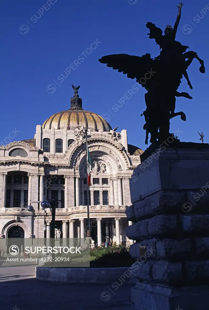 Palace of Las Belles Artes, Mexico City ;Originally designed by Italian architect, Adamo Boari in 1901, it wasn't completed until 1934. It was built of imported white Italian marble in grandiose Art Nouveau style incorporating chevron freizes and stylized masks of the rain God, Chac.