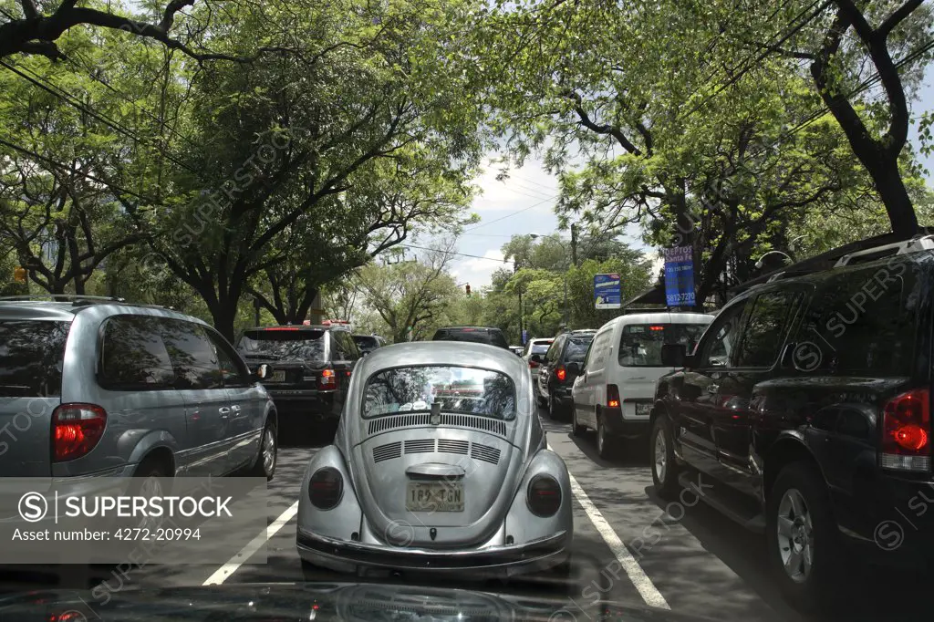 Mexico, Mexico City. Rush hour traffic on the Paseo de la Reforma, one of the most beautiful avenues in Mexico City.