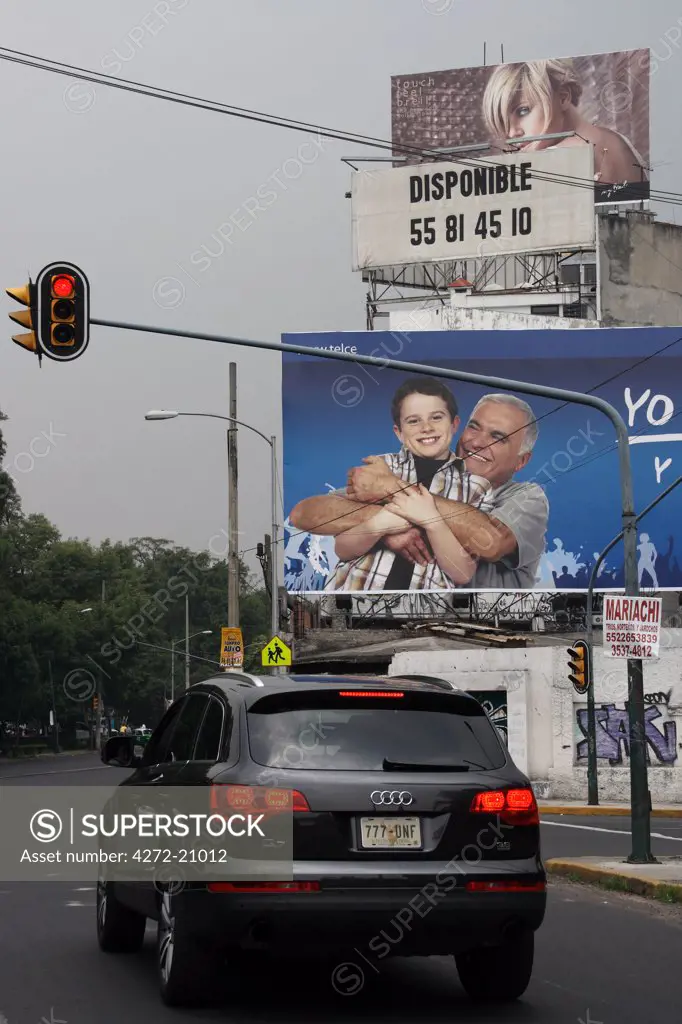 Mexico, Mexico City. Billboards line the street in Mexico City.