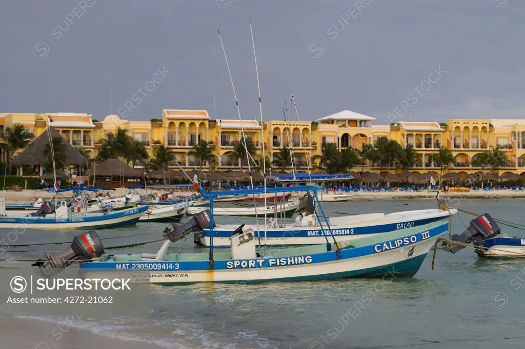 Playa del Carmen, Mexico. Fishing charter boats on the beach in Playa del Carmen Mexico