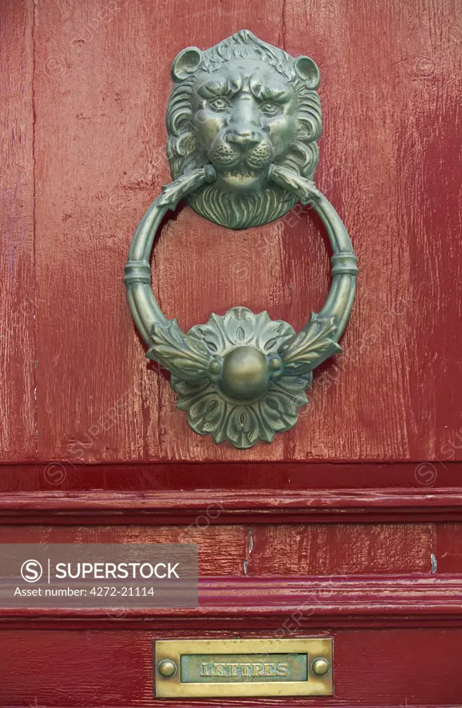 Malta, Mdina. A lion's head door knocker on a door in the medieval walled city of Mdina