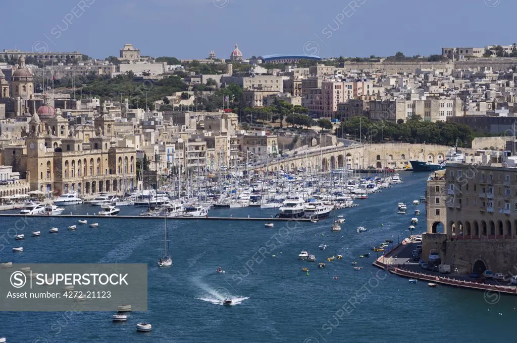 Malta, Vittoriosa.  View across Valletta's Grand Harbour to Dockyard Creek and Vittoriosa with its elegant buildings and busy marina.