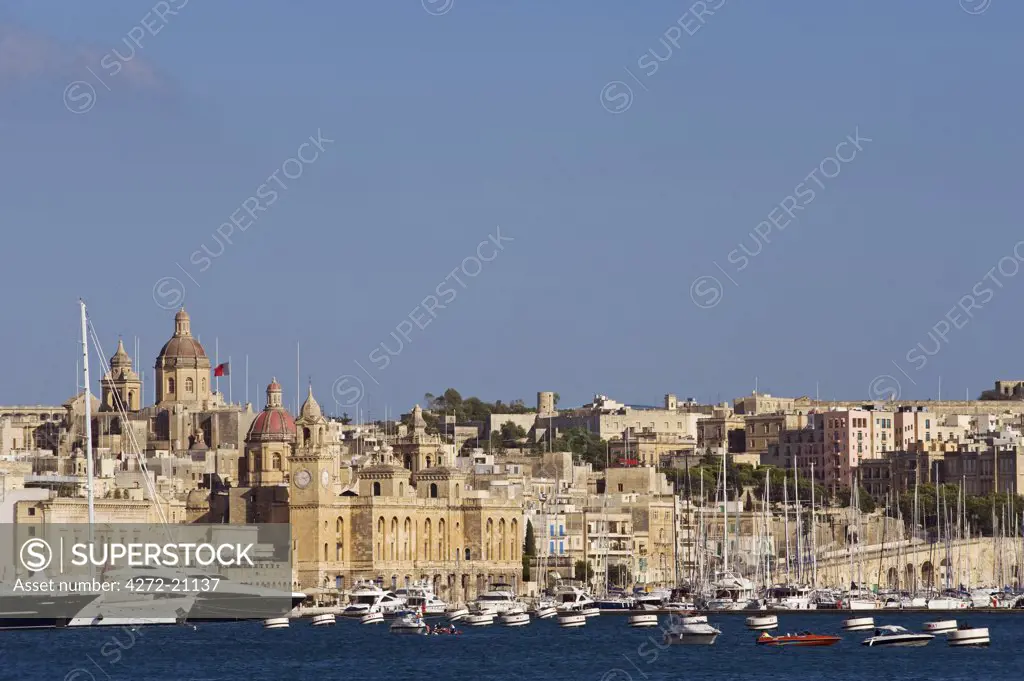 Malta, Valletta.  View of Vittoriosa and the Church of St Lawrence across Valletta's Grand Harbour.