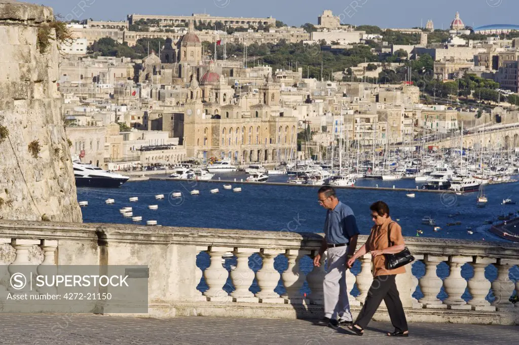 Malta, Valletta. An elegant ballustrade on the old walls of Valletta provides a panoramic view over the Grand Harbour towards Vittoriosa.