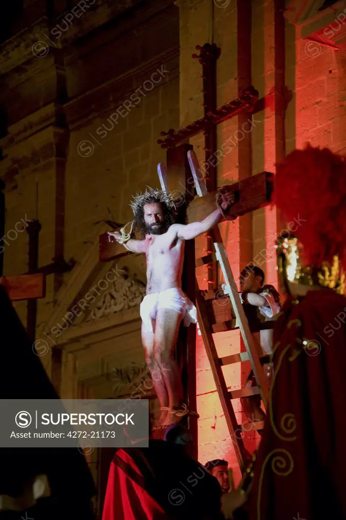 Europe, Malta; A crucified Christ during a street peagant organised by amateurs at the town of Tarxien.