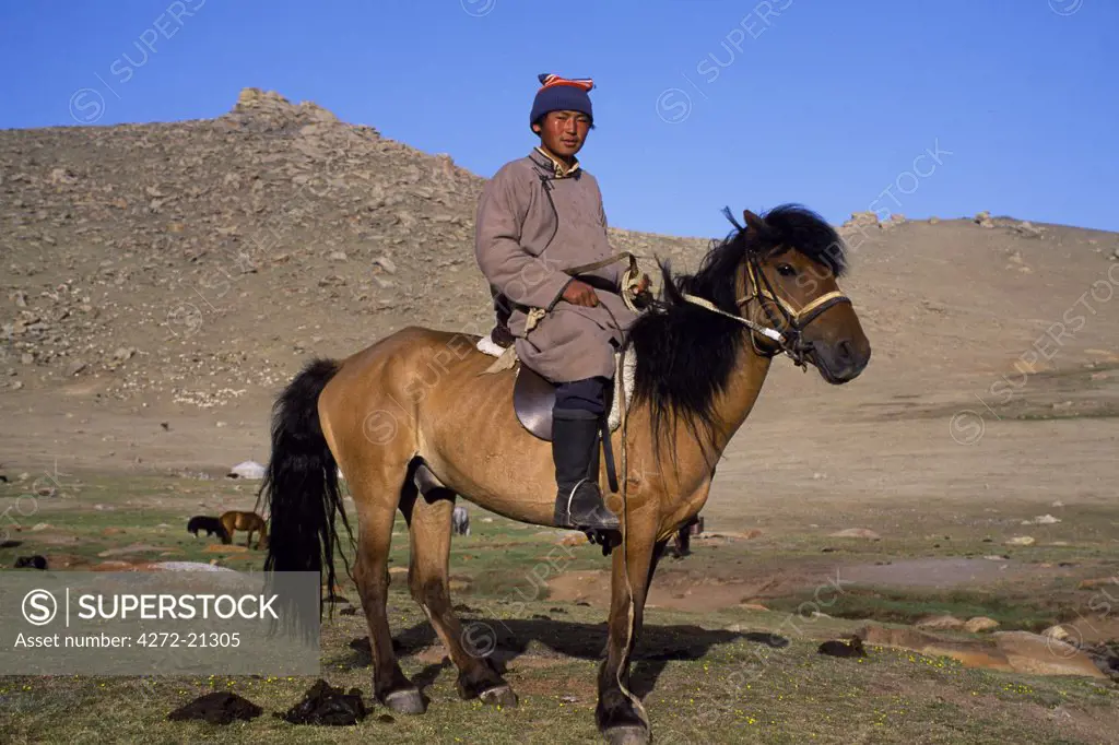 Mongolia, Khovd (also spelt Hovd) aimag (region), Mongolian man on ahorse.