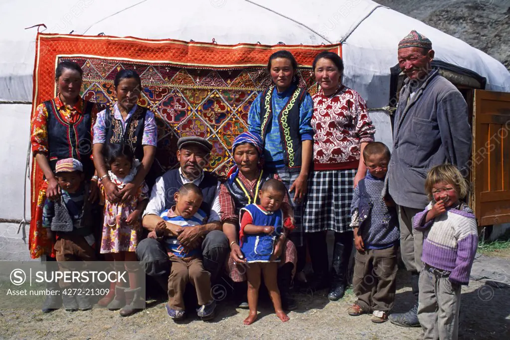 Mongolia, Khovd aimag region, family assembled outside ger, Nomads tent.  The Russian name for ger is yurta, from which we get yurt.  The ger is a unique model of engineering, an ingenious prefabricated home.  The design is ideally suited to a Nomadic lifestyle.
