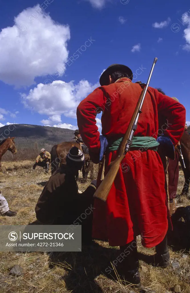 Mongolia, Khentii Province. Horse Herders having a rest.