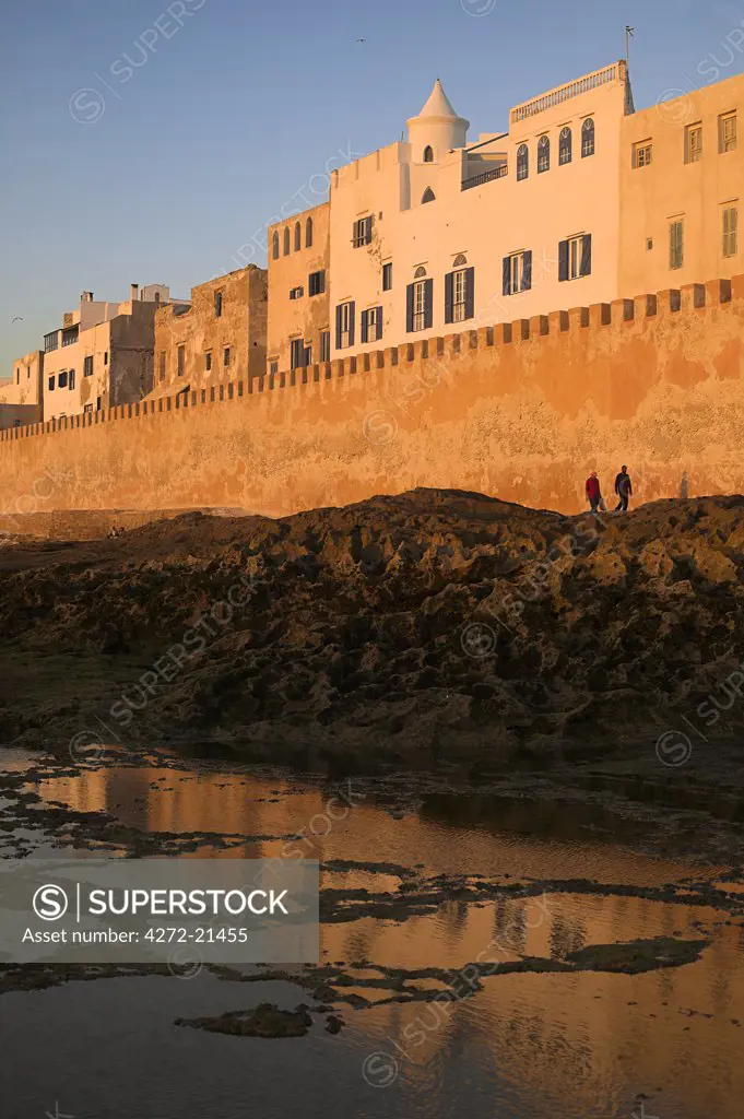 The city walls surrounding the old medina in Essaouira, Morocco. At low tide it is possible to clamber out onto the rocks and look back at the walls from the sea.