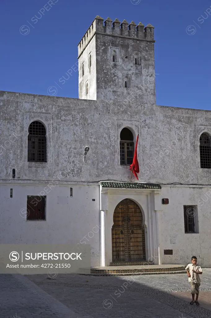 A boy runs through the Place du Tabor in the kasbah of Tangier, the highest point of the city.