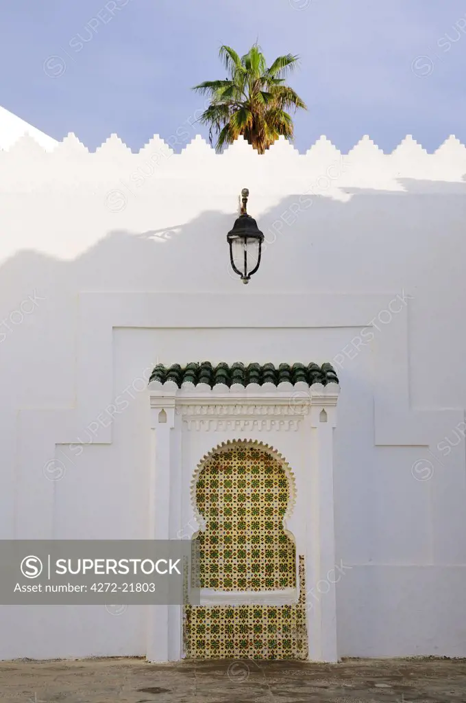 Decorated fountain inside Asilah medina. Morocco