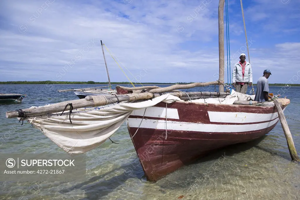A dhow captain waits for high tide in the harbour of Ibo Island, part of the Quirimbas Archipelago, Mozambique