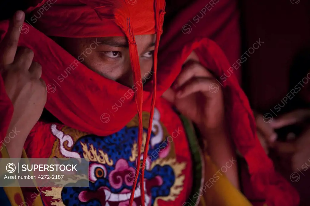 Bhutan. Participants at the tsechu in Wangdue Phodrang getting ready for a performance.