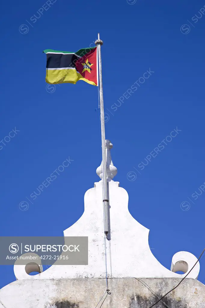 A Mozambique flag flies over the naval museum housed in an old colonial building on Ilha do Mozambique, the former capital of Portuguese East Africa