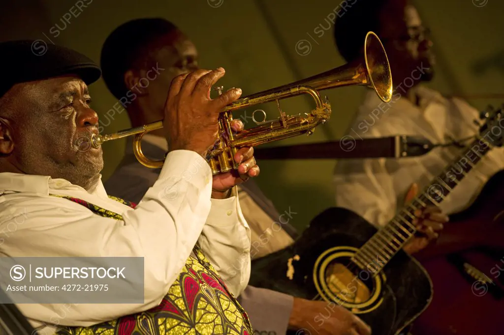 Mozambique, Maputo. A trumpet player performs with his band at Maputo Music festival 2009 at the Municipal building in Maputo, Mozambique.