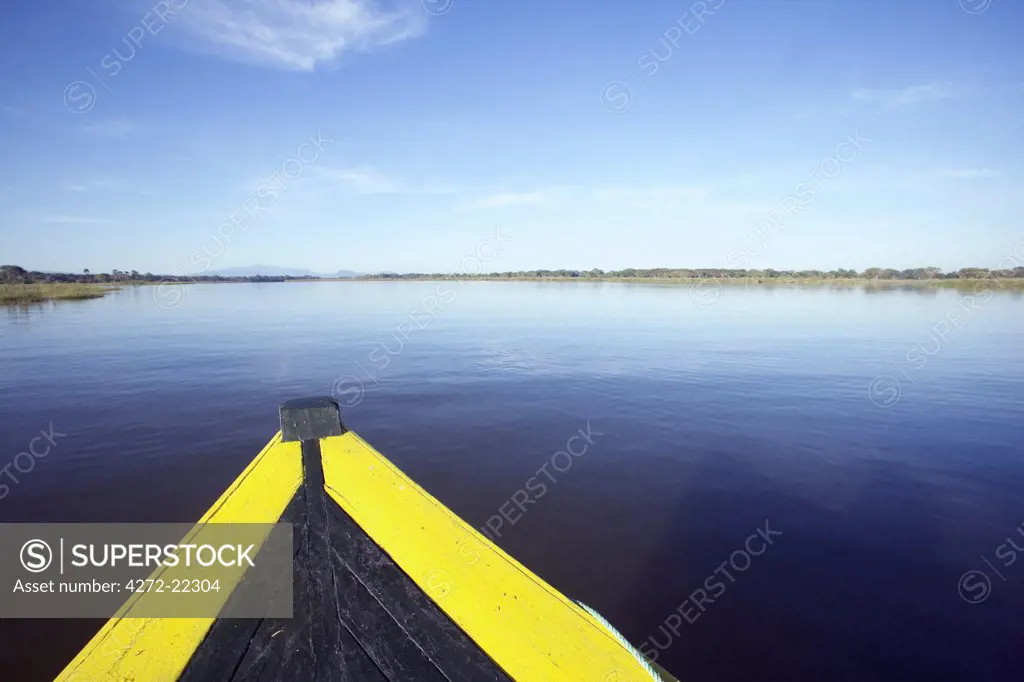 Malawi, Upper Shire Valley, Liwonde National Park. The bows of a safari boat exploring the channels of the Shire River.
