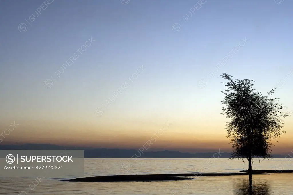 Malawi, Lake  Malawi - stunning sunset over a tranquil Lake Malawi.