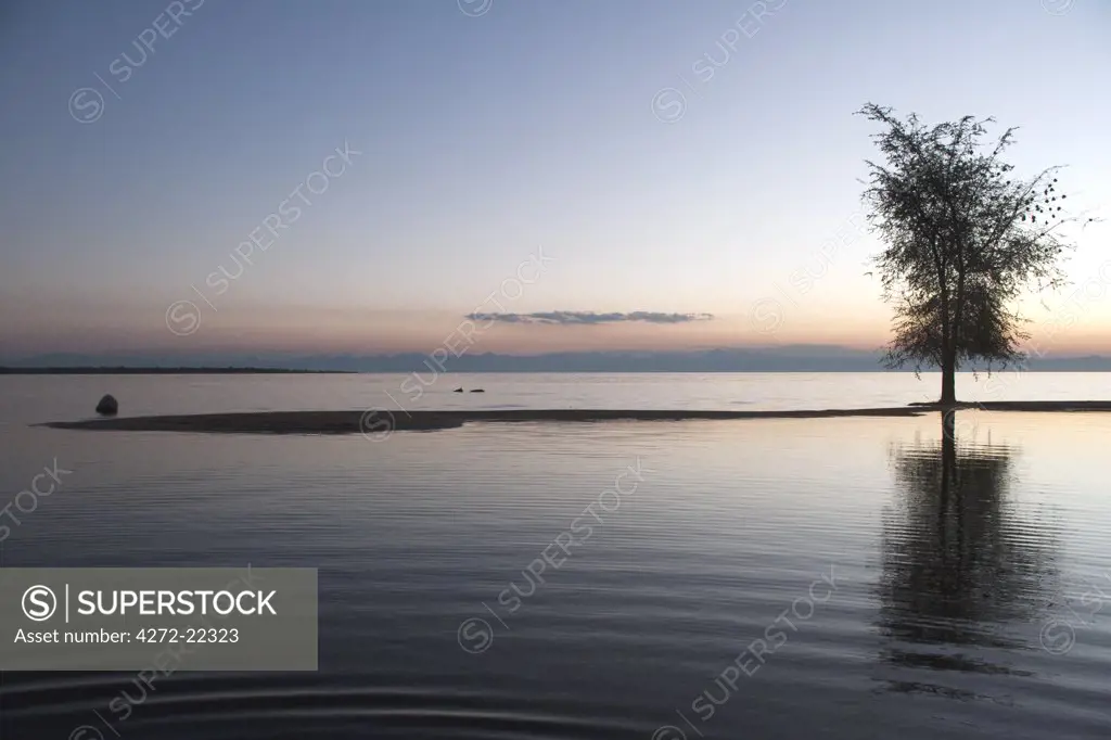 Malawi, Lake  Malawi - stunning sunset over a tranquil Lake Malawi, the perfect place for sundowners.