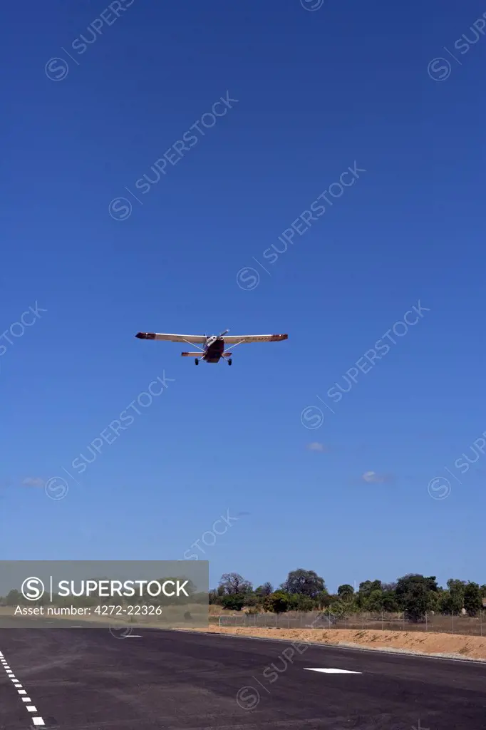Malawi, Lake Malawi, Likoma Island.   An air taxi takes off from the airstrip on Likoma Island in the middle of Lake Malawi