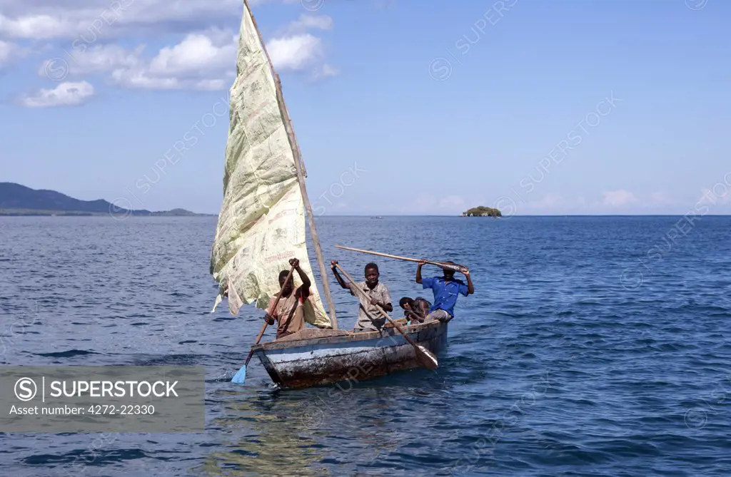 Malawi, Lake Malawi, fishermen sailing on the open waters of this fresh water lake in handmade canoes.