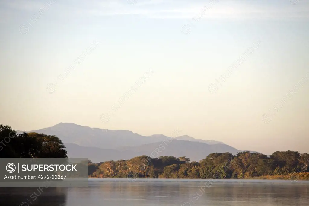 Malawi, Upper Shire Valley, Liwonde National Park.  Early morning sunrise over the Shire River.