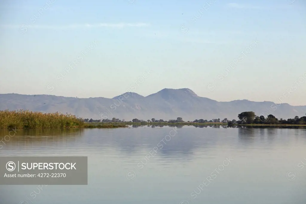 Malawi, Upper Shire Valley, Liwonde National Park. Early morning sunrise over the Shire River.