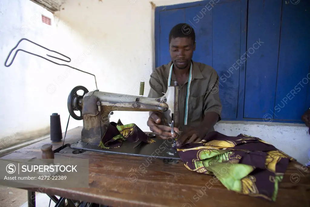 Malawi, Lake Malawi, Likoma Island. A tailor illustrates the type of small industry that typifies Malawian towns