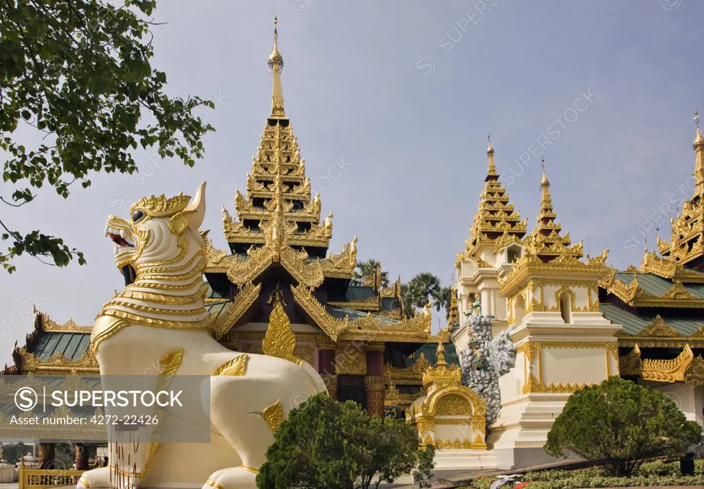 Myanmar. Burma. Yangon. Chinthe (half lion, half dragon guardians) at the entrance to Shwedagan Golden Temple.