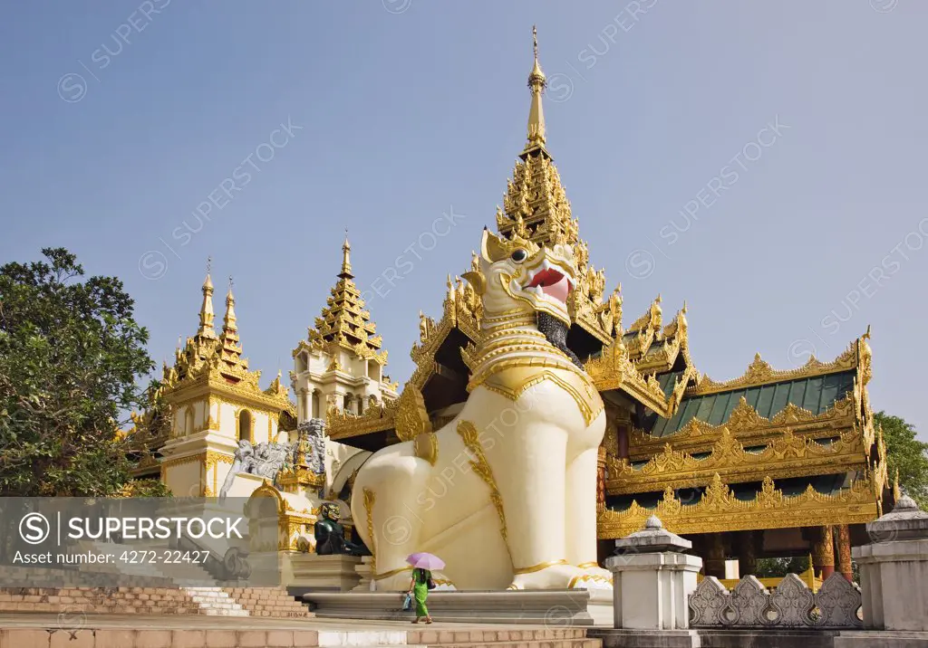 Myanmar, Burma, Yangon. Chinthe (half lion, half dragon guardians) at the entrance to Shwedagan Golden Temple, the largest and most scared of all Buddhist sites.