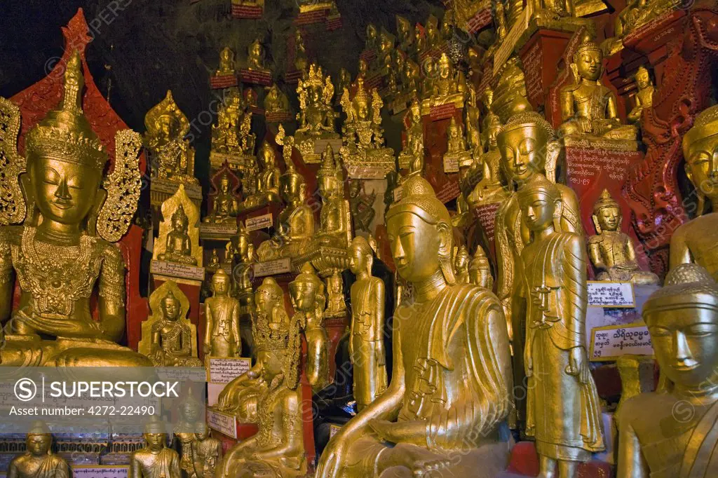 Myanmar. Burma. Pindaya. Some of the 8,000 golden statues of Buddha that are housed in the extensive limestone caves at Pindaya.