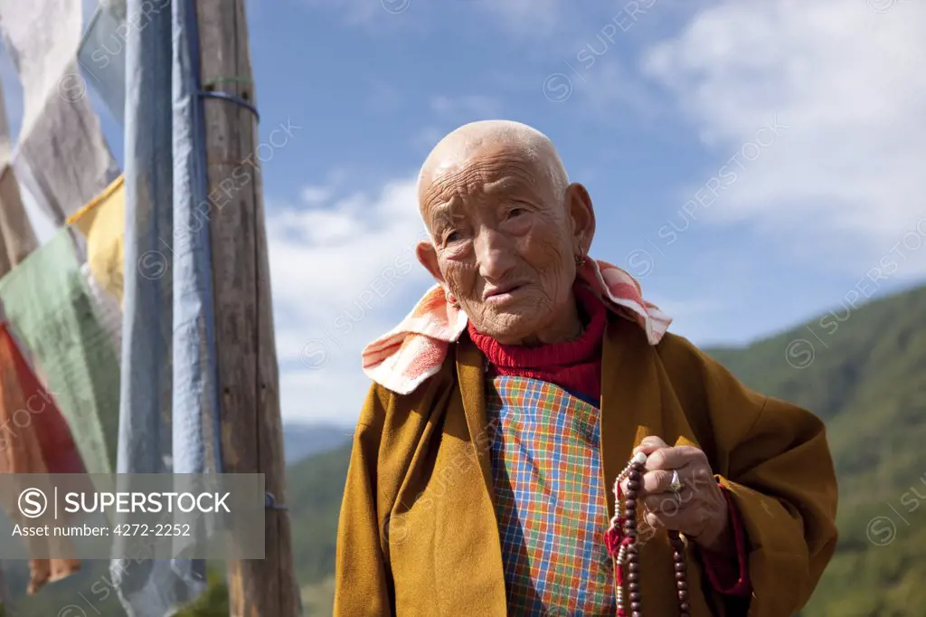 An elderly buddhist woman in Bhutan