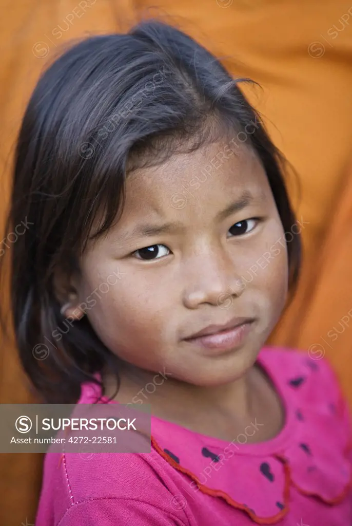 Myanmar. Burma. Wanpauk village. A young Palaung girl at Wanpauk village. The Palaung are a part of the Tibetan-Myanmar group of tribes.