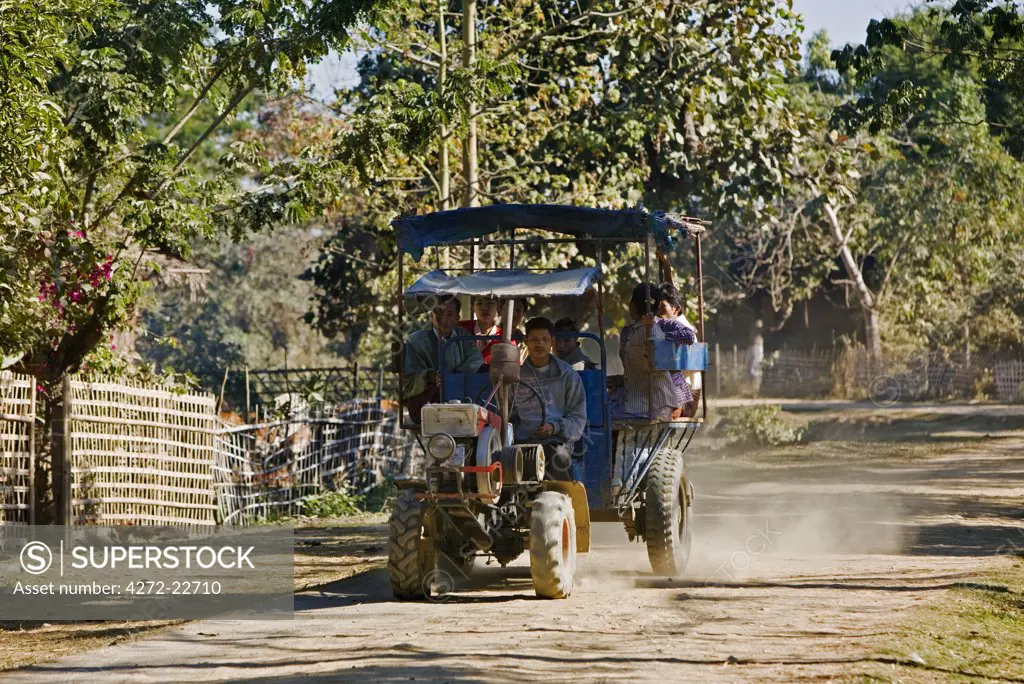 Myanmar, Burma, Mrauk U. A Chinese-made all-purpose tractor and trailer on the road to Mrauk U.