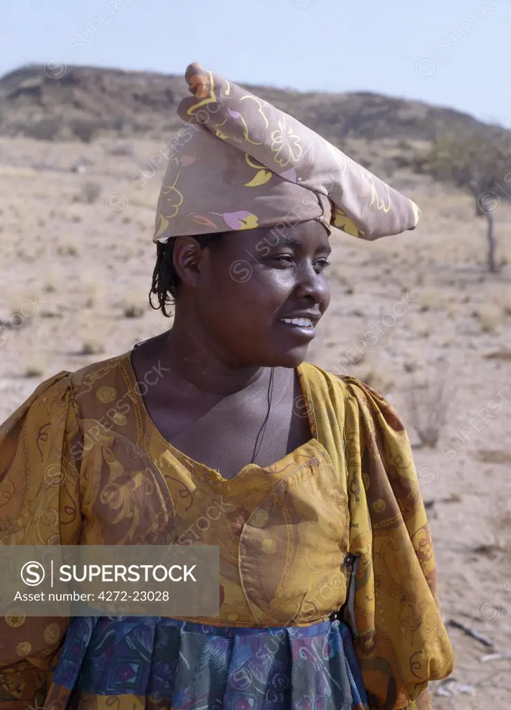 An Herero woman. The origins of her elaborate dress and unique hat style can be traced back to 19th century German missionaries who took exception to what they considered an immodest form of dress among the tribe.