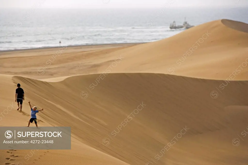 Namibia, Erongo Region, Swakopmund. The coastal dune belt between Swakopmund and Walvis Bay provides an ideal recreational area for those partaking in quad biking and sand boarding as well as families and young children. (MR)