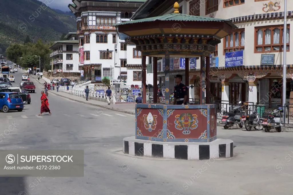 A traffic cop in an intersection in downtown Thimphu Bhutan