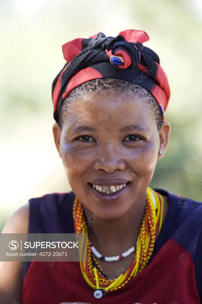 Namibia, Bushmanland. Portrait of a San (Bushman) woman at Nhoqma village (pronounced //Nhoq'ma) near Tsumkwe in northeast Namibia.