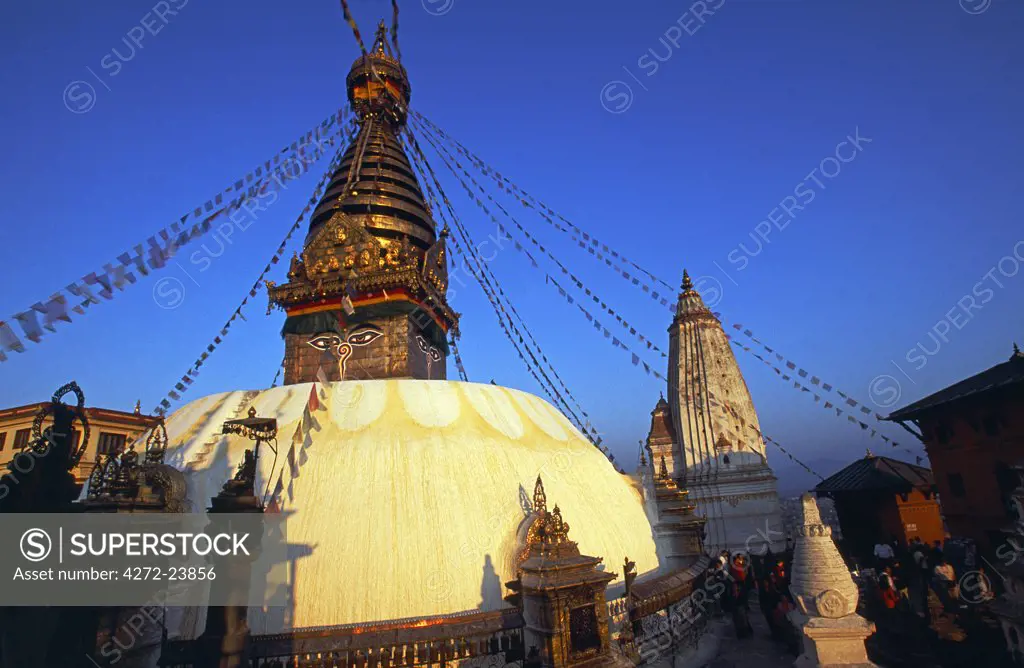 Buddhist shrine of Swayambhu at sunset. Legend connects Swayambhu, the self born, primordial Buddha, with the earliest origins of Kathmandu. The Swayambhu Stupa, painted with the eyes of the omnipresent god, forms the centerpiece of the temple complex.
