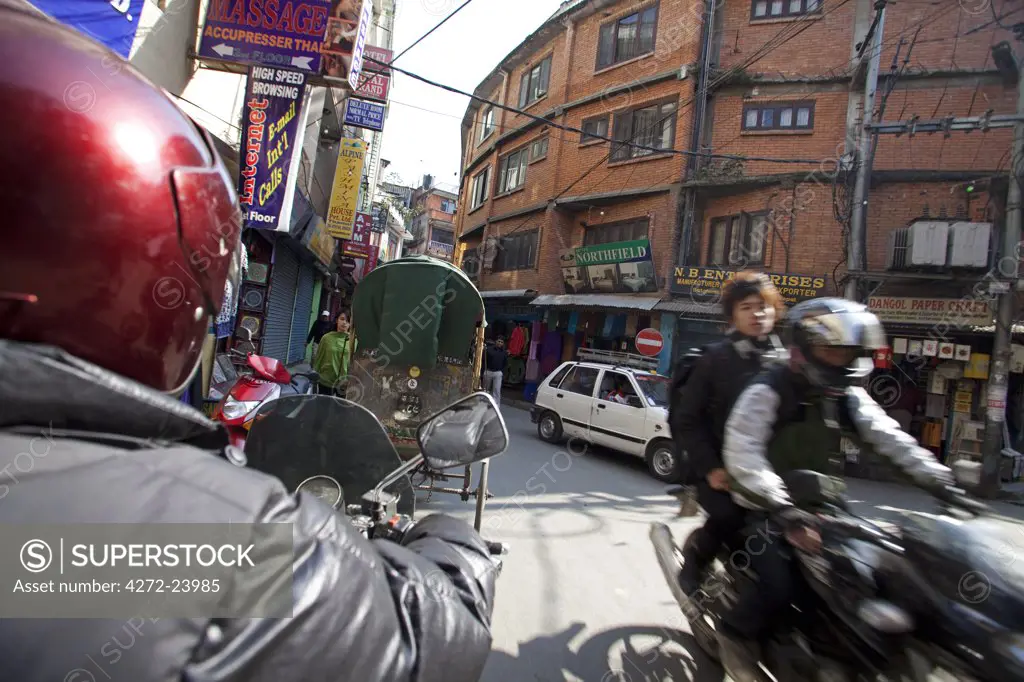 Nepal, Kathmandu. High speed travel on a motorbike through the bussling streets of Nepals capital.