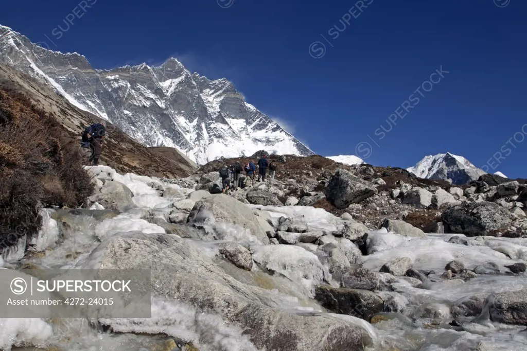 Nepal, Everest Region, Khumbu Valley.  Glacial boulder strewn river coming from the wall of the south face of Lhotse