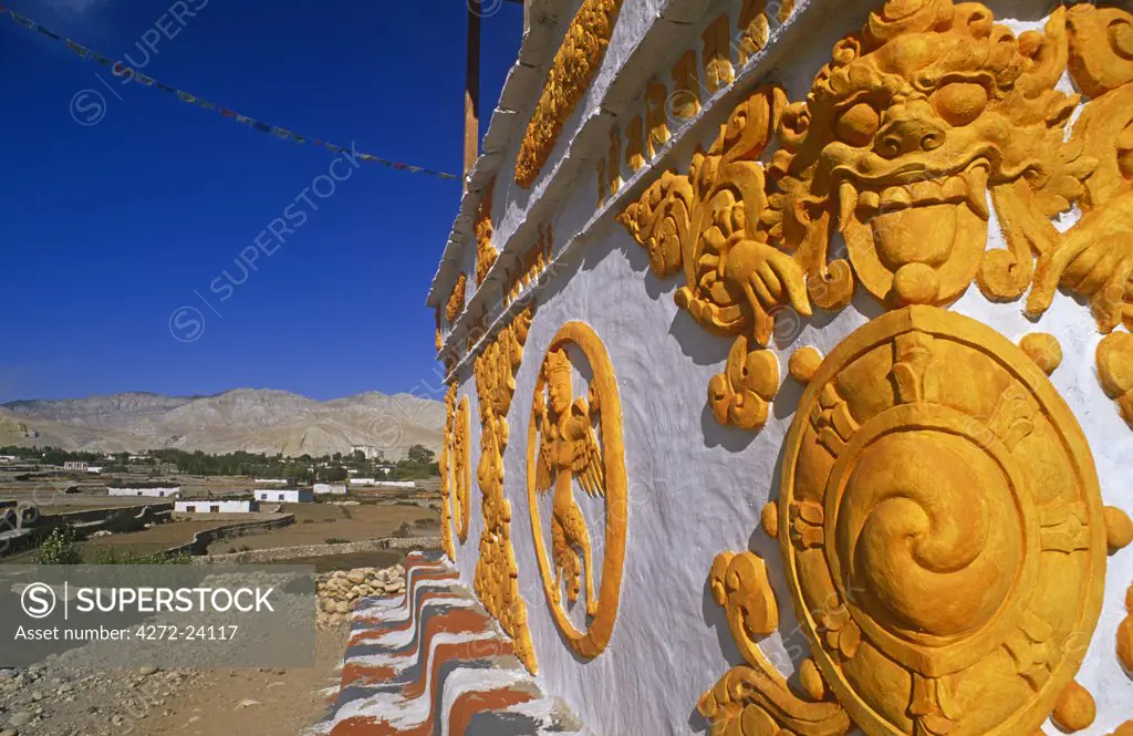 Nepal, Himalaya, Mustang, Charang. A decorative chorten, or Buddhist shrine, marks the southern entrance to Charang village.