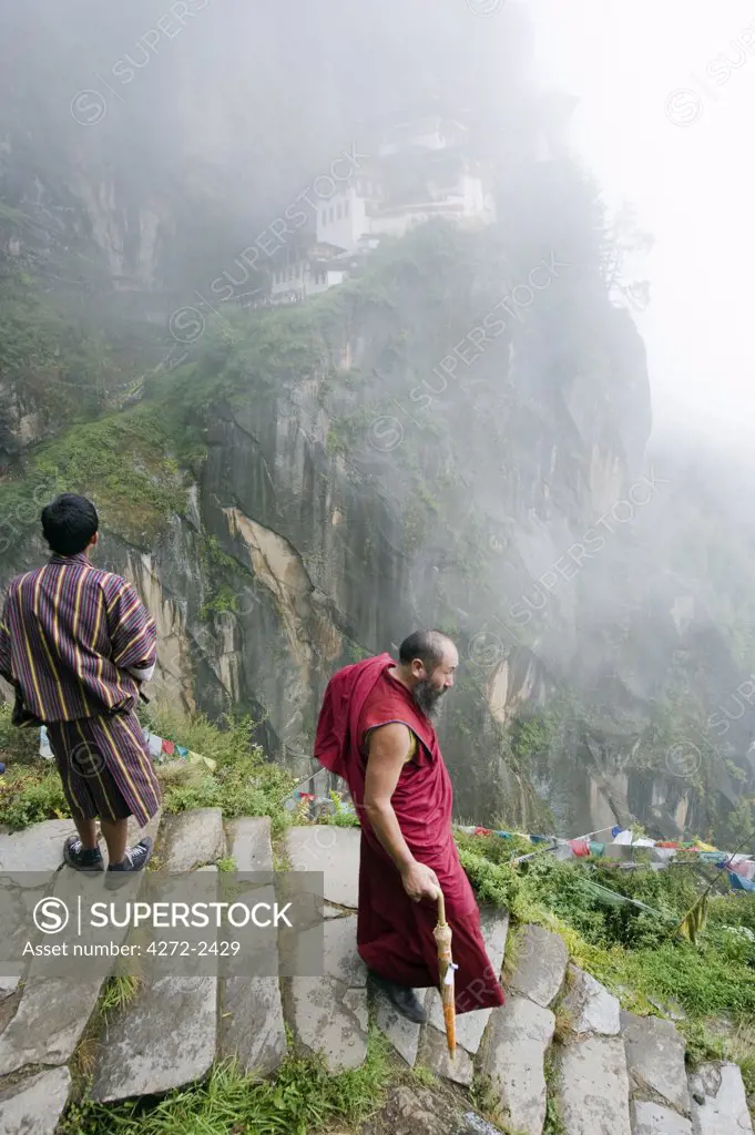 Asia, Bhutan, Paro Valley, Tigers Nest, Taktshang Goemba, monk on a stone path