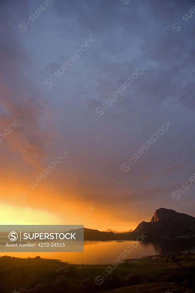 Norway, Nordland, Helgeland. The midnight sun over the islands surrounding the island of Rodoy Island.