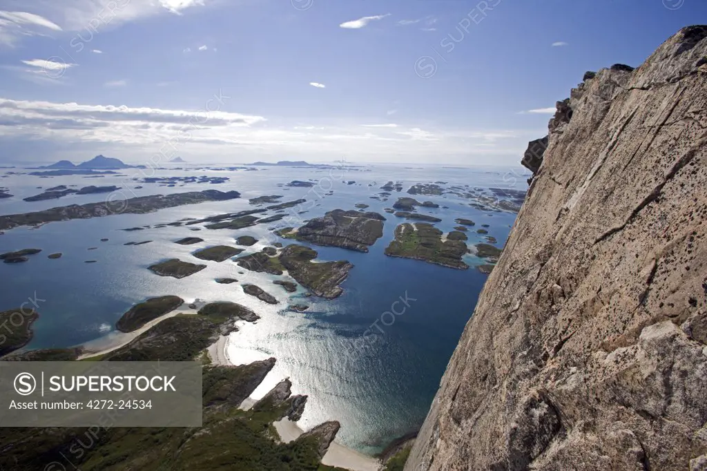 Norway, Nordland, Helgeland, Rodoy Island. View of the surrounding islands from the 400 metre high peak of Rodoylova, which translated means 'Lion of Rodoy' and which from a distance also looks like a sphinx.