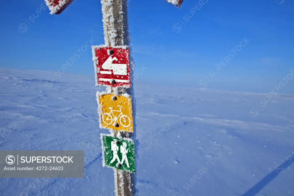 Norway, Finnmark Region. A sign post in the Arctic Circle