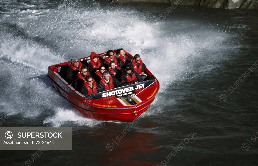 Tourists ride the Shotover Jet on the Shotover River
