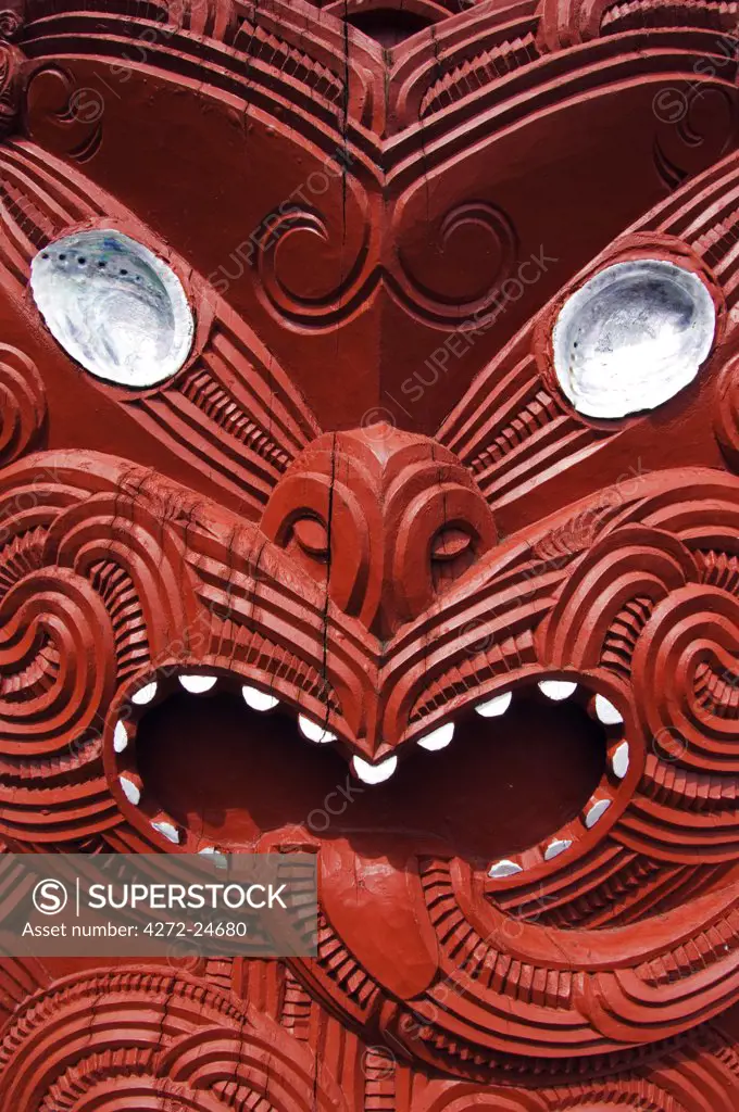 New Zealand, North Island, Rotorua. Carvings on a Whare Whakairo meeting house in Te Puia Maori Village. Carvings in particular were a means of preserving tribal history in an oral society, carved figures represent dead persons and manifestations of an ancestor.